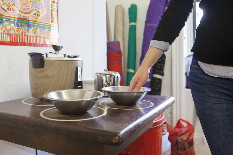 Touching a rice bowl to trigger a piece of oral history